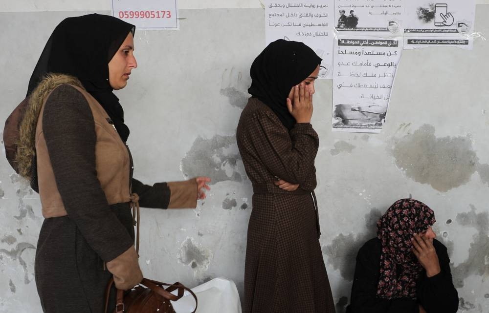 Palestinian mourners react during the funeral of Palestinians killed in Israeli airstrikes, in Gaza City, on Friday. REUTERS