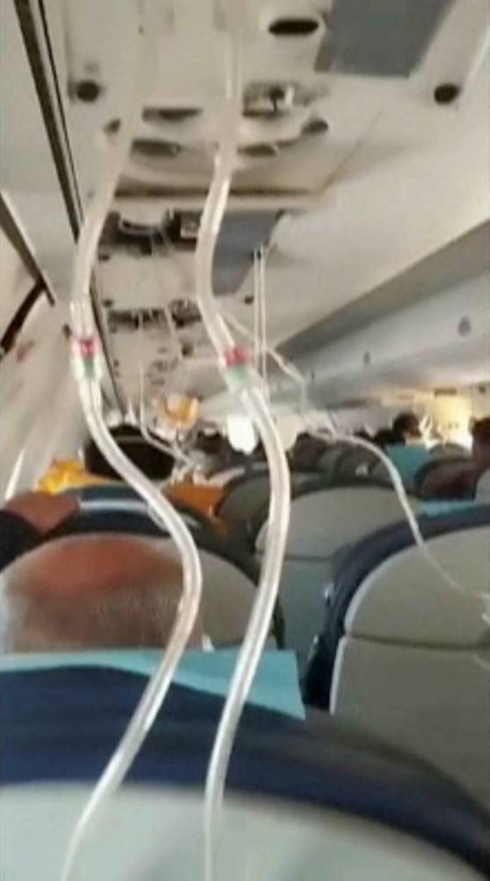 Passengers using oxygen masks inside an Azerbaijan Airlines' Embraer plane operating the flight from Baku to Grozny before the crash near the Kazakh city of Aktau, on Wednesday, in this still image taken from a social media video. Social Media/via REUTERS