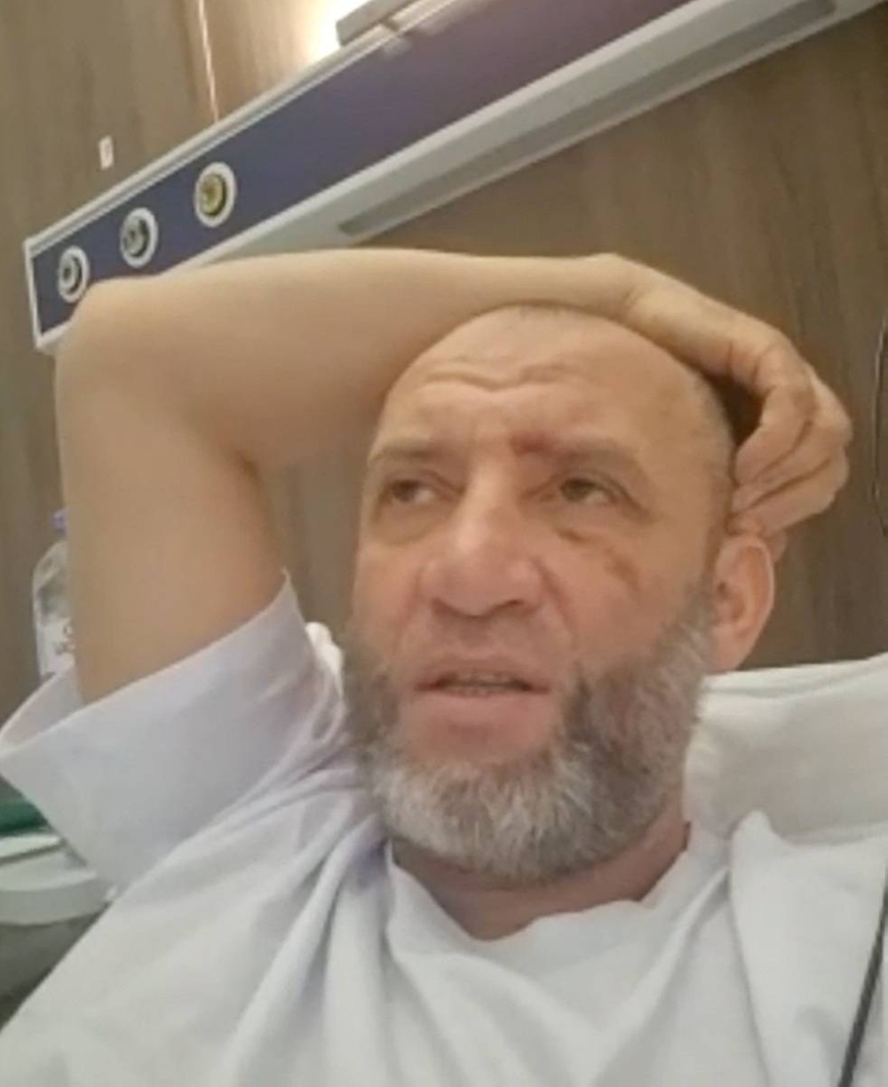 Subhonkul Rakhimov, one of the passengers on the Azerbaijan Airlines plane that crashed in Kazakhstan, speaks during an interview with Reuters via a video call from a hospital at an unidentified location, on Friday, in this still image taken from a video. Reuters TV/via REUTERS