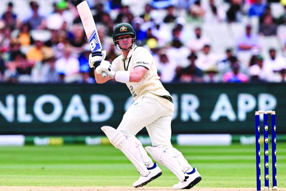 Australia’s batsman Steve Smith plays a shot on the second day of the fourth Test against India at the Melbourne Cricket Ground on Friday. (AFP)
