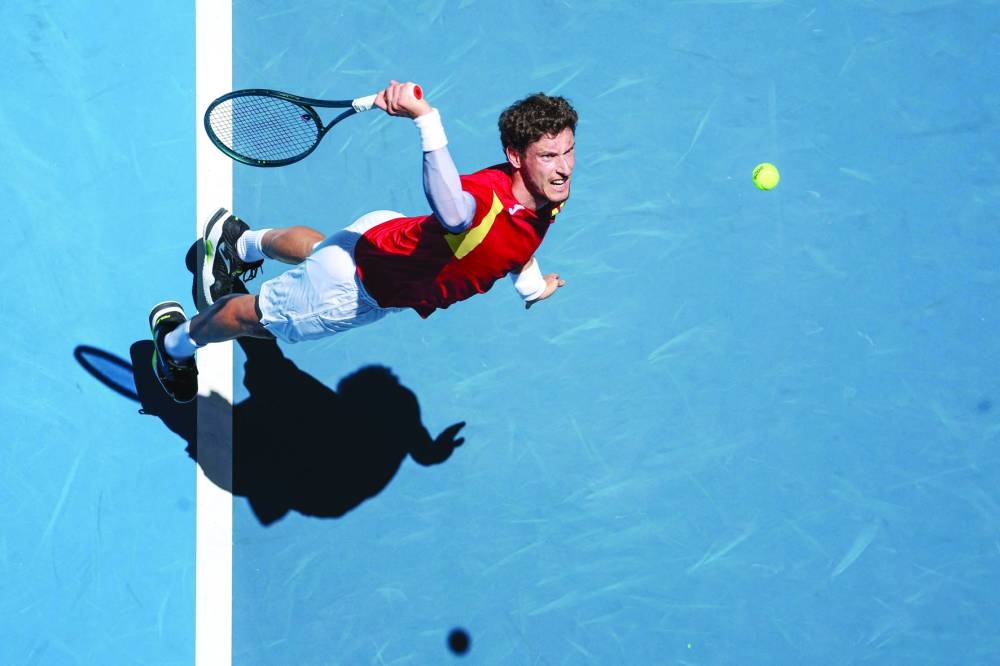 Spain’s Pablo Carreno Busta serves against Kazakhstan’s Alexander Shevchenko during their singles match at the United Cup in Perth on Friday. (AFP)