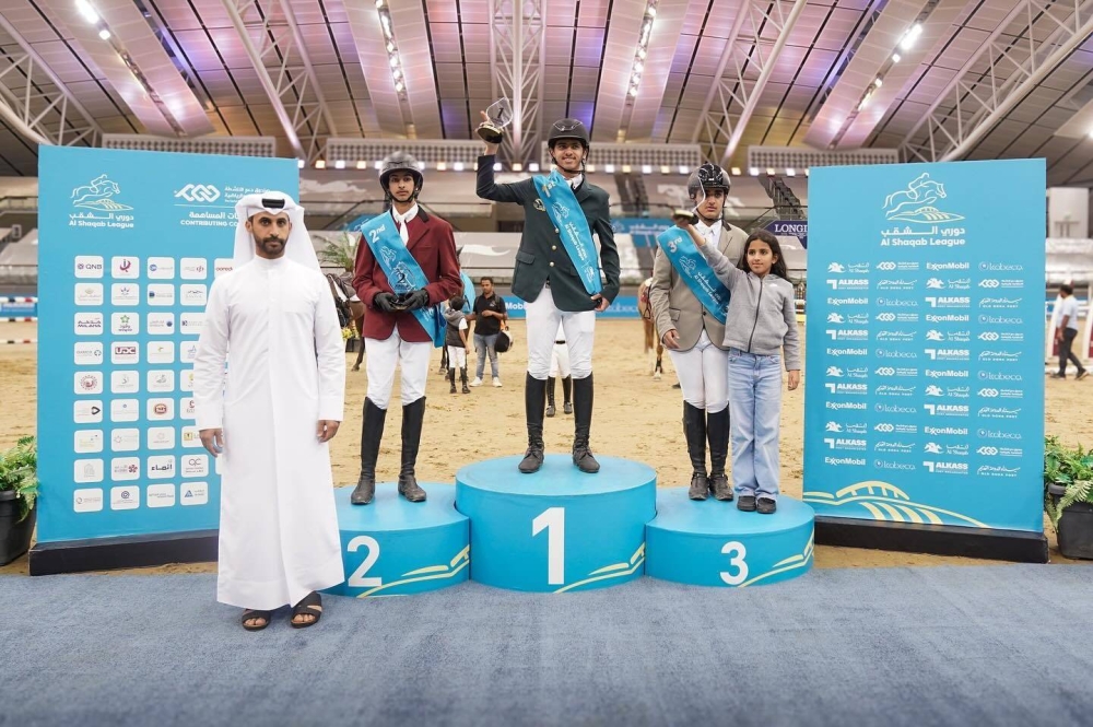 
Khalid al-Nuami, Al Shaqab League Manager, awarded the riders of the Junior Champions Class 115cm. Right: A rider in action. 