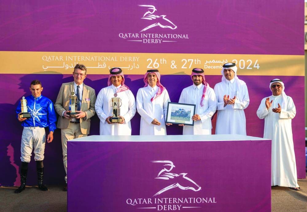 
Connections of Al Zeer pose after the colt retained the Gr 2 PA Qatar International Derby. 