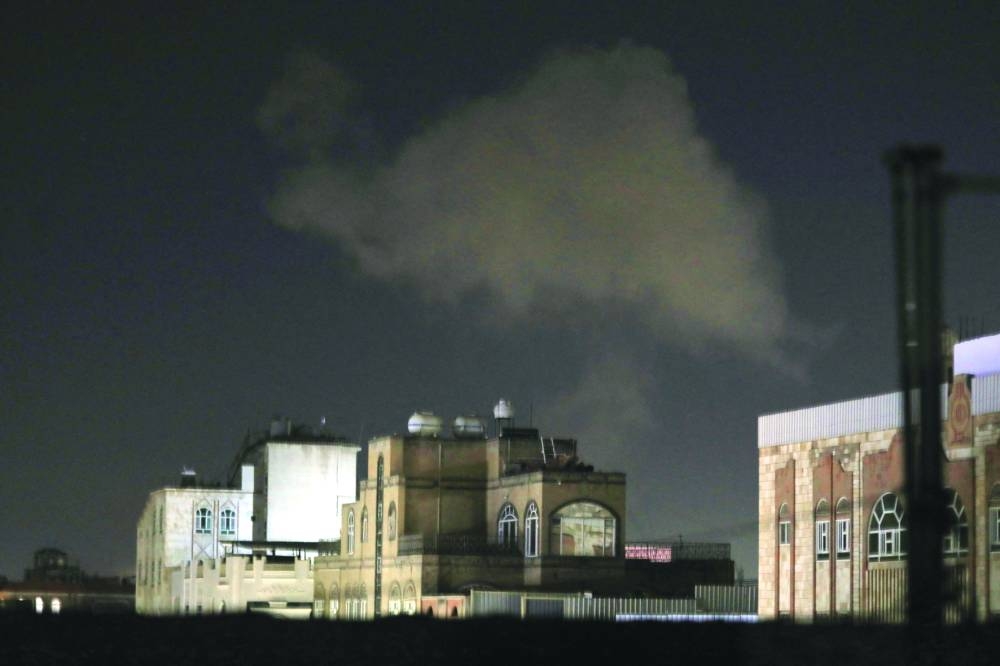 Smoke billows after an air strike on Yemen's capital Sanaa, yesterday.