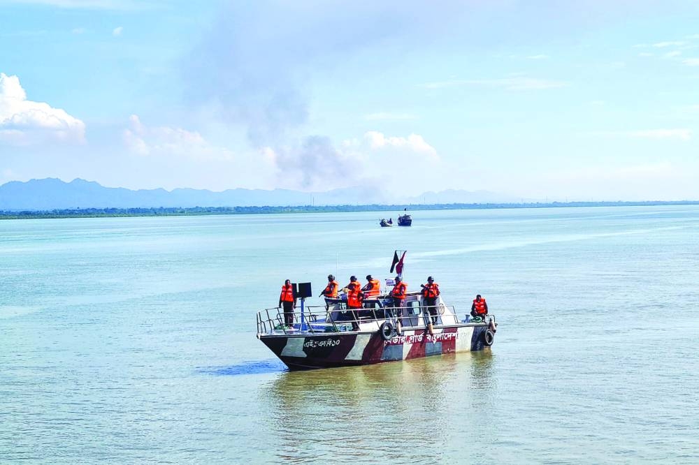 
Border Guard Bangladesh personnel patrol near the Bangladesh-Myanmar border in Teknaf. 