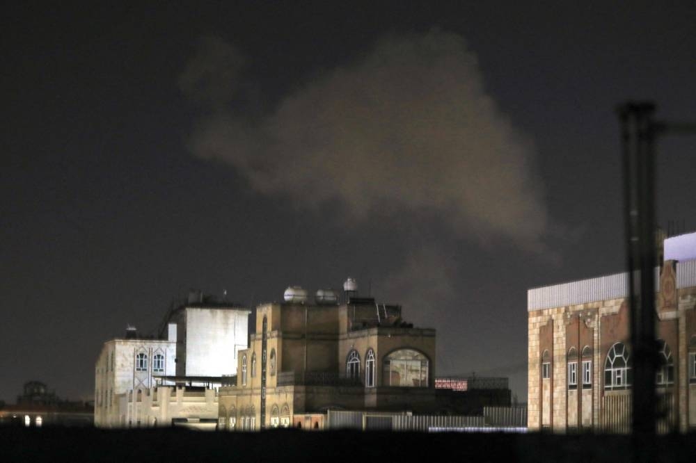 Smoke billows after an airstrike on Yemen's capital Sanaa on Friday. AFP