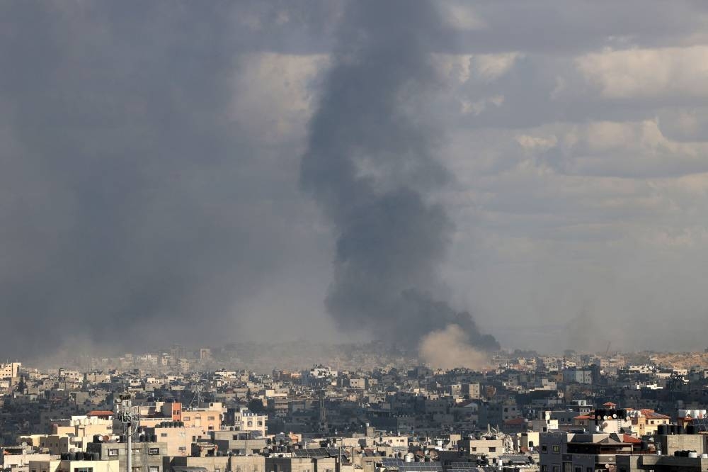 Smoke billowing after an Israeli strike in the north of the Palestinian territory on Sunday. AFP