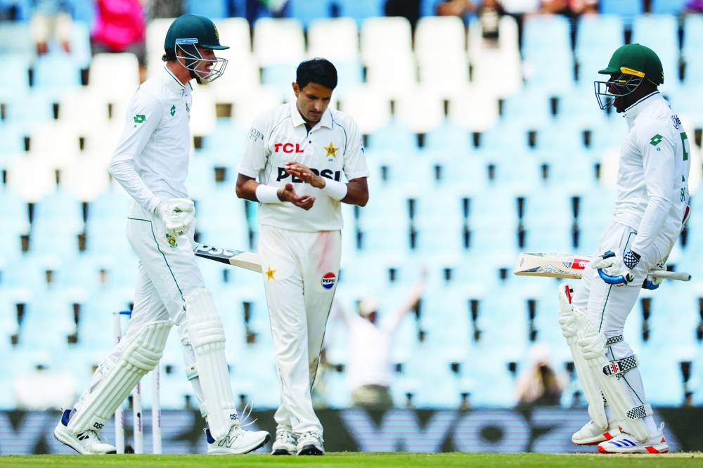 Pakistan’s Mohammad Abbas (centre) applauds as South Africa’s Marco Jansen (left) and South Africa’s Kagiso Rabada (right) celebrate South Africa winning the match during the fourth day of the first Test at SuperSport Park in Centurion yesterday. (AFP)