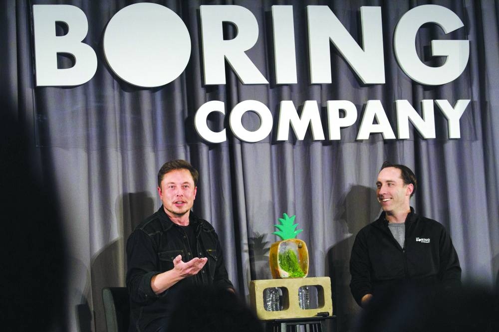 
Elon Musk, left, with Steve Davis. (Bloomberg) 