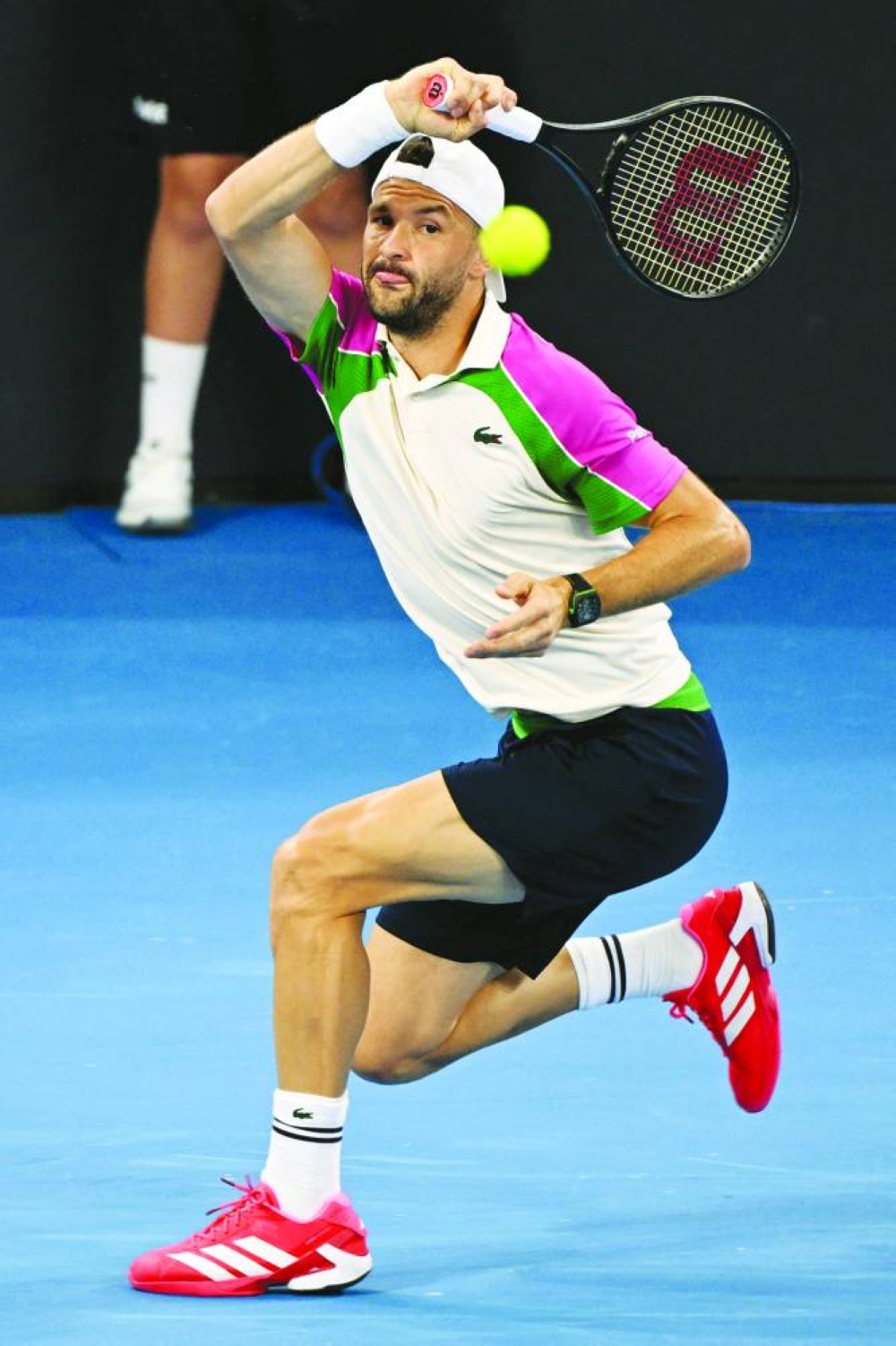 Grigor Dimitrov of Bulgaria hits a return during his match against Yannick Hanfmann of Germany at the Brisbane International on Monday. (AFP)