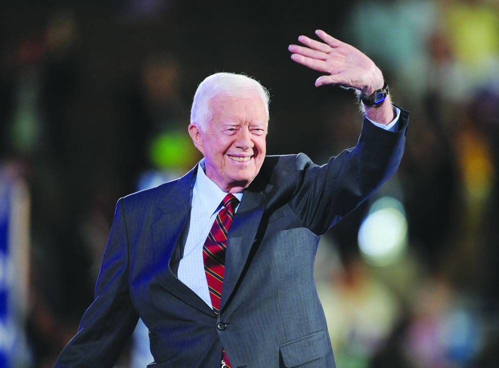 
Former president Jimmy Carter waves to the crowd at the Democratic National Convention 2008 at the Pepsi Center in Denver, Colorado, on August 25, 2008. (AFP) 