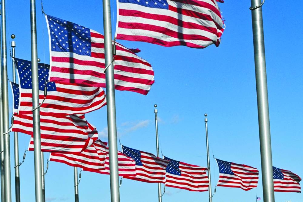 
US flags fly at half-staff on the National Mall near the White House in honour of former US president Jimmy Carter, in Washington, DC. – AFP 
