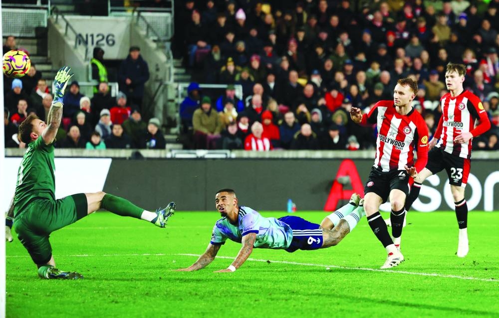 
Arsenal’s Gabriel Jesus (centre) scores past Brentford’s goalkeeper Mark Flekken during the Premier League match in London. (Reuters) 