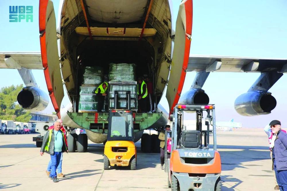 First aid from Saudi Arabia arrives in Damascus, yesterday.