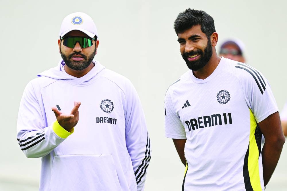 India’s Rohit Sharma (left) chats with a teammate Jasprit Bumrah during a practice session ahead of the fifth Test against Australia at the Sydney Cricket Ground on Thursday. (AFP)