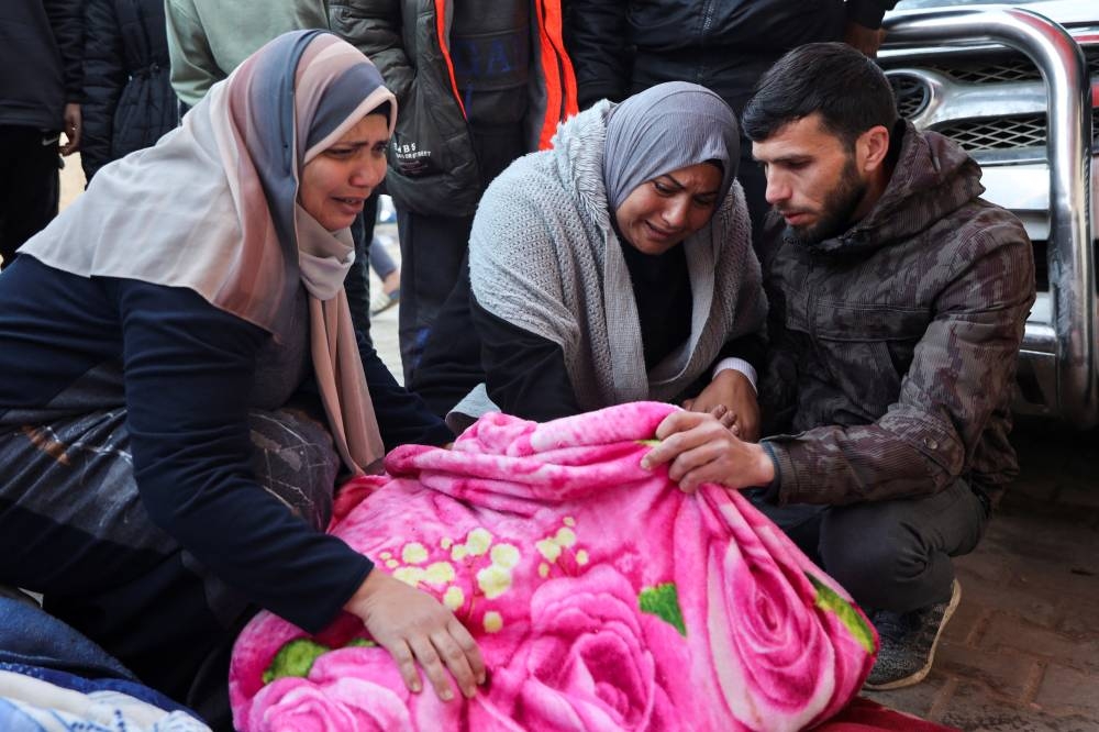 Mourners attend the funeral of Palestinians killed in Israeli strikes, at Al-Aqsa Martyrs Hospital in Deir Al-Balah in the central Gaza Strip, on Friday. REUTERS