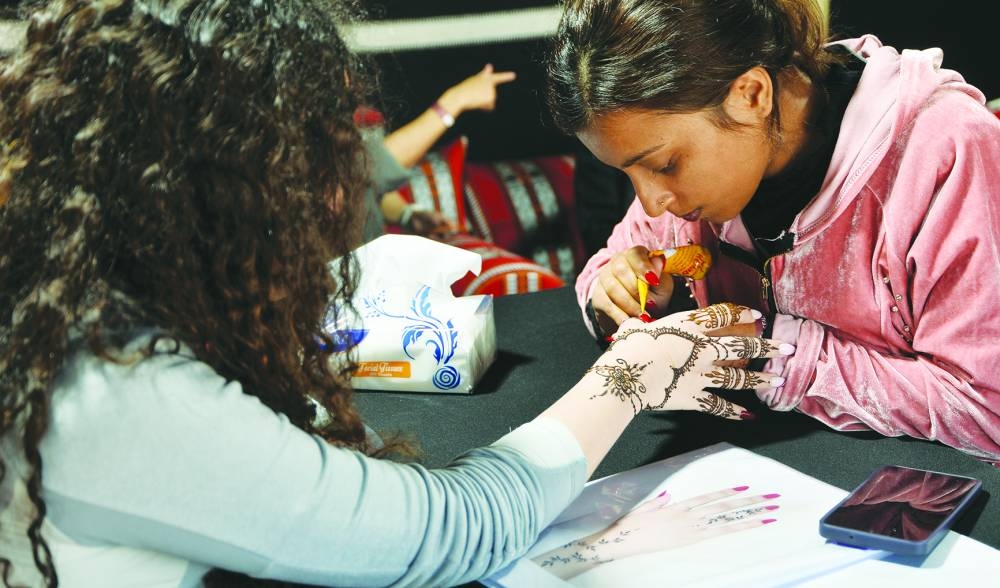 Free activities cater to all ages such as henna painting and calligraphy.  PICTURE: Shaji Kayamkulam