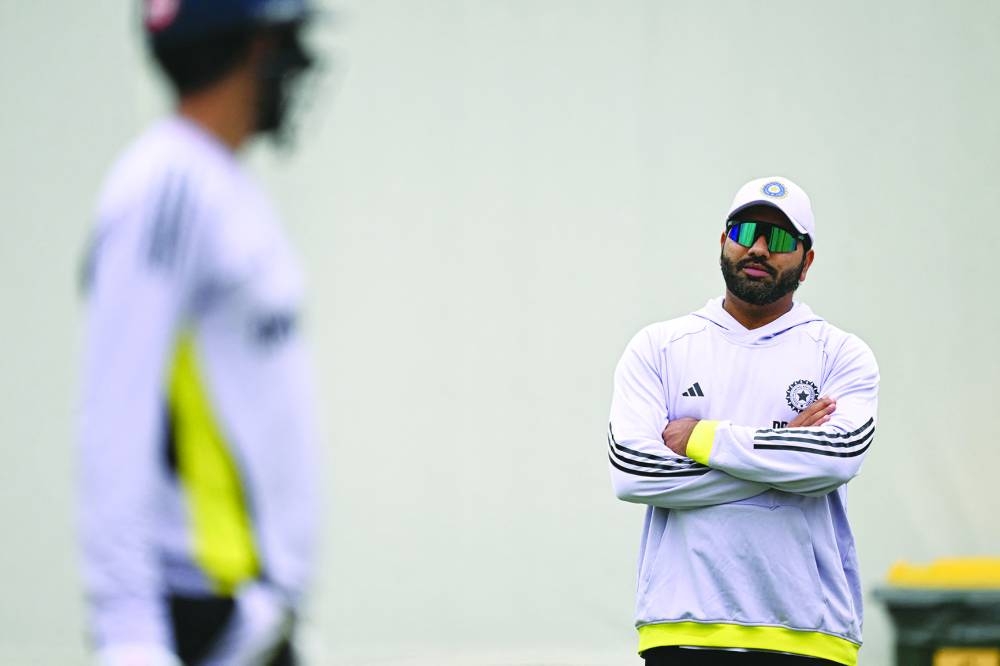 India's Rohit Sharma watches teammates during a practice session ahead of the fifth Test match between Australia and India at the Sydney Cricket Ground in Sydney on Thursday. (AFP)