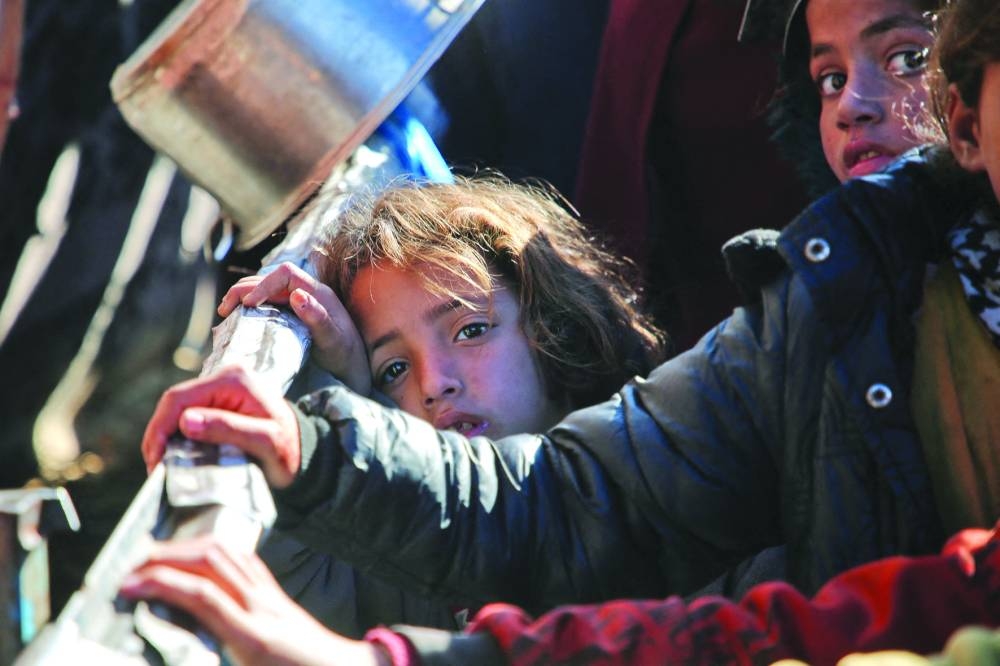 
A forlorn looking Palestinian girl gazes into the camera. (Reuters) 