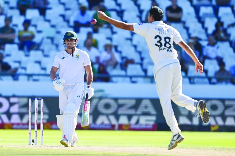 Pakistan’s Mohammad Abbas (right) fields off his own bowling after a shot played by South Africa’s David Bedingham during the fourth day of the second Test at Newlands Stadium in Cape Town on Monday. (AFP)