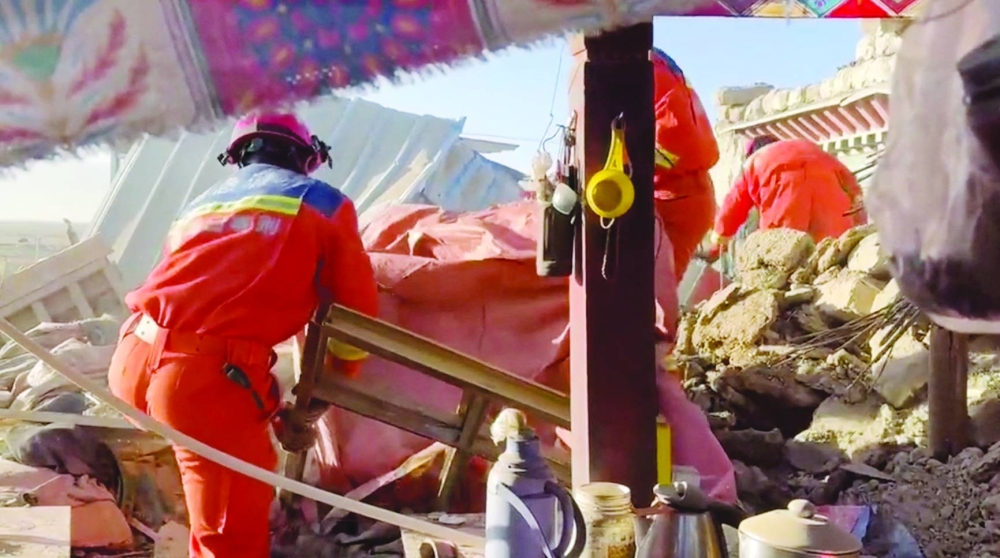 
Rescue teams work amid rubble in the aftermath of an earthquake in a location given as Shigatse City, Tibet Autonomous Region, China, yesterday. 