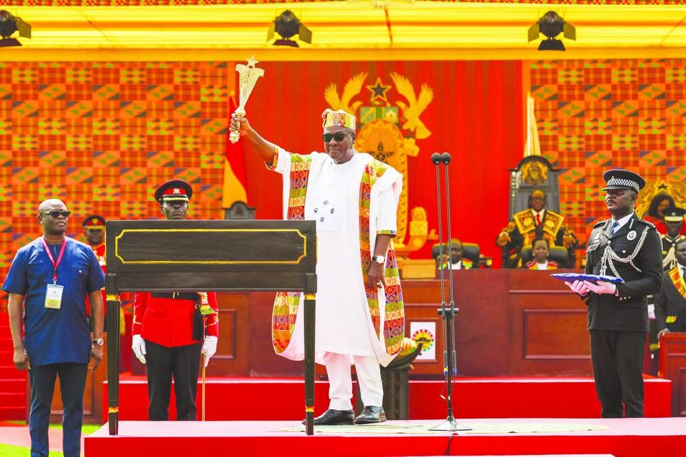 
Ghana’s new President John Mahama holds state sword after taking the oath of office at his inauguration at the Independence Square in Accra, yesterday. 