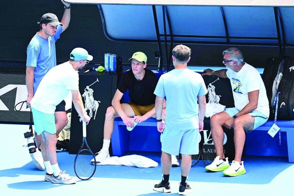 Italy’s Jannik Sinner reacts during a practice session ahead of the Australian Open in Melbourne on Saturday. Right: Belarus’ Aryna Sabalenka during a practice session. (AFP)