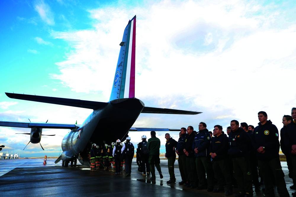 
A Mexican military and fire aid team prepare to board a plane bound for California to help fight wildfires, at Felipe Angeles International Airport in Zumpango, Mexico. – Reuters 