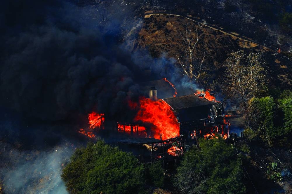 
An house burns as the Palisades Fire rages on at the Mandeville Canyon, in Los 
Angeles, California. – Reuters 