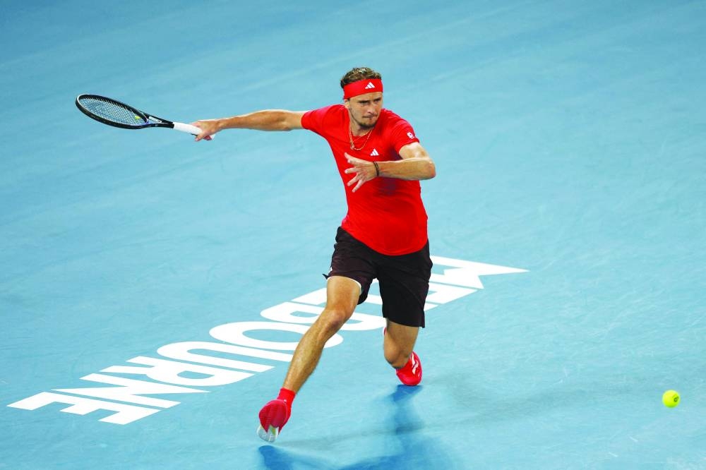 Germany's Alexander Zverev hits a shot against France's Lucas Pouille during their singles match on day one of the Australian Open in Melbourne yesterday. (AFP)
