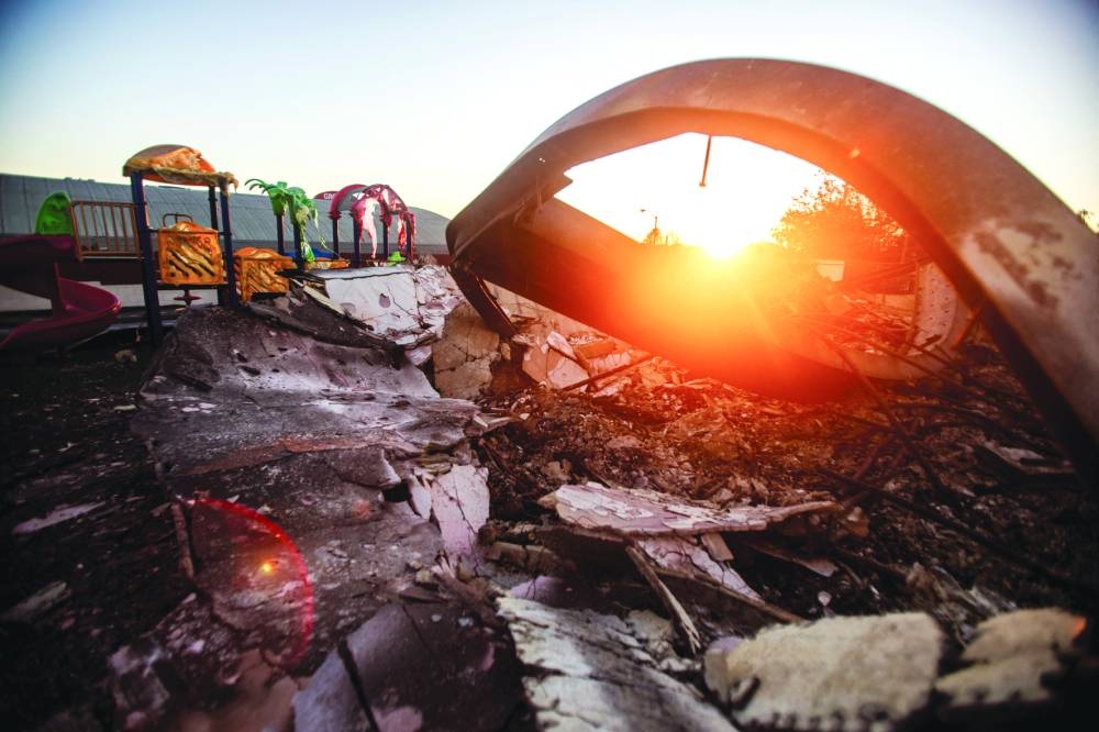 A playground melted and destroyed by fire is seen in a burnt area as the Eaton Fire, one of several simultaneous blazes ripping across Los Angeles County continues, in Altadena, California on Tuesday.