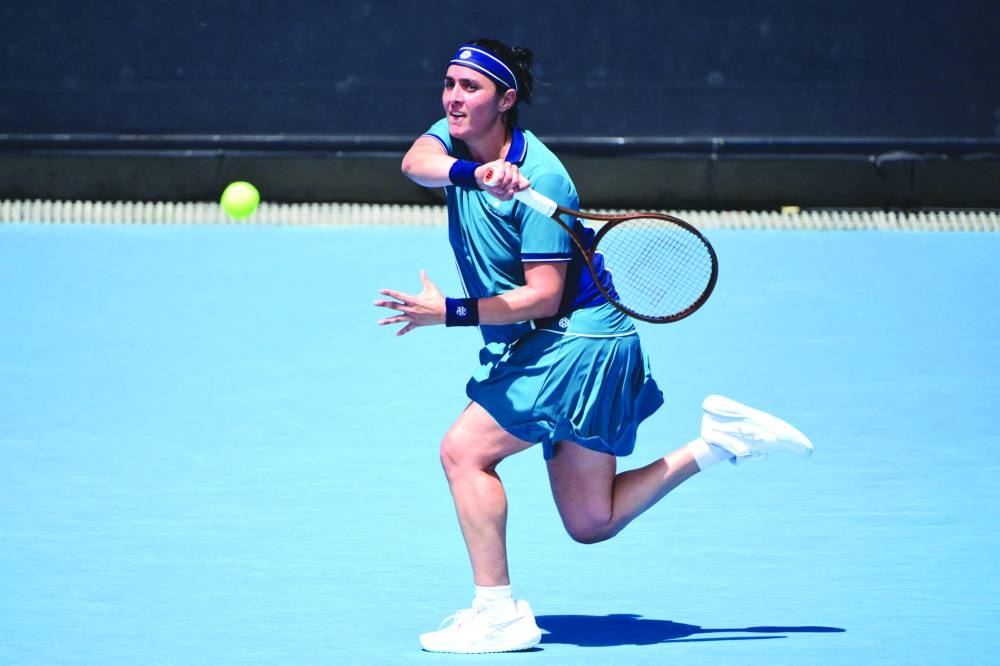 Tunisia’s Ons Jabeur hits a return against Colombia’s Camila Osorio during their Australian Open match in Melbourne on Thursday. (AFP)