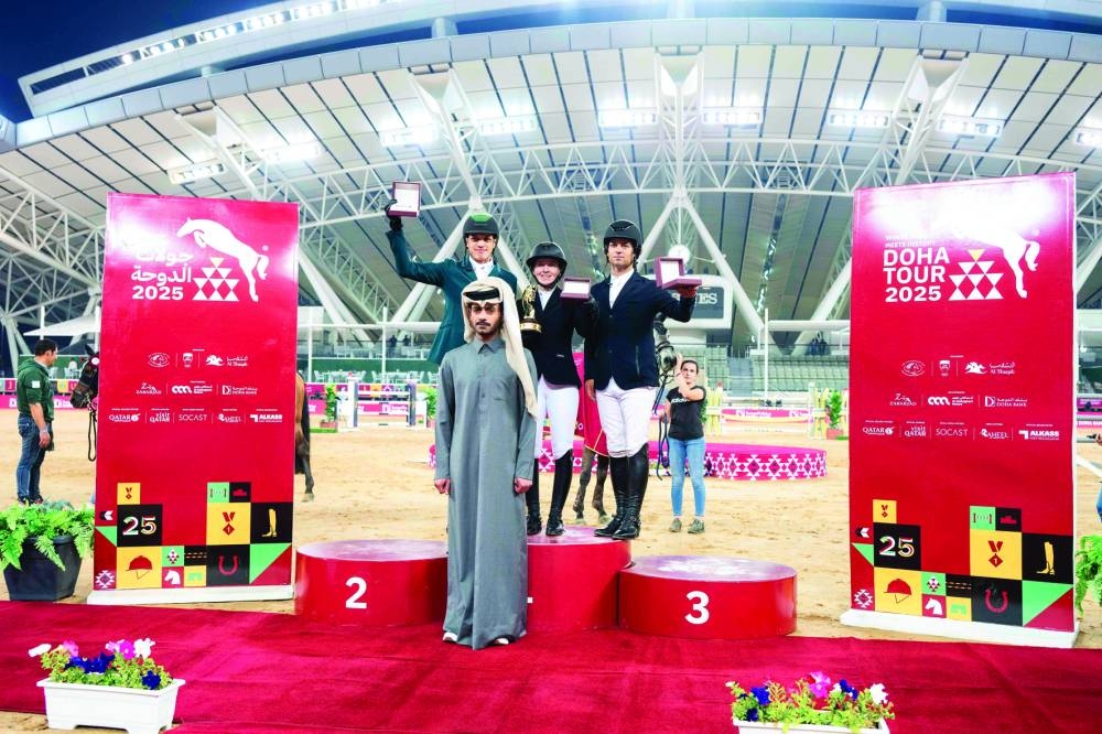 Sheikh Mohammed bin Fahad al-Thani, representative of Doha Bank, poses with CSI4* - Faults & Time class winner Millie Allen, runner-up Abdullah Alsharbatly and third-placed Duarte Seabra.