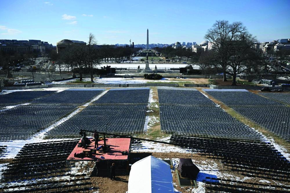 Seats are arranged yesterday near the West Front of the US Capitol building, where the presidential inauguration traditionally takes place, in Washington, DC. – AFP