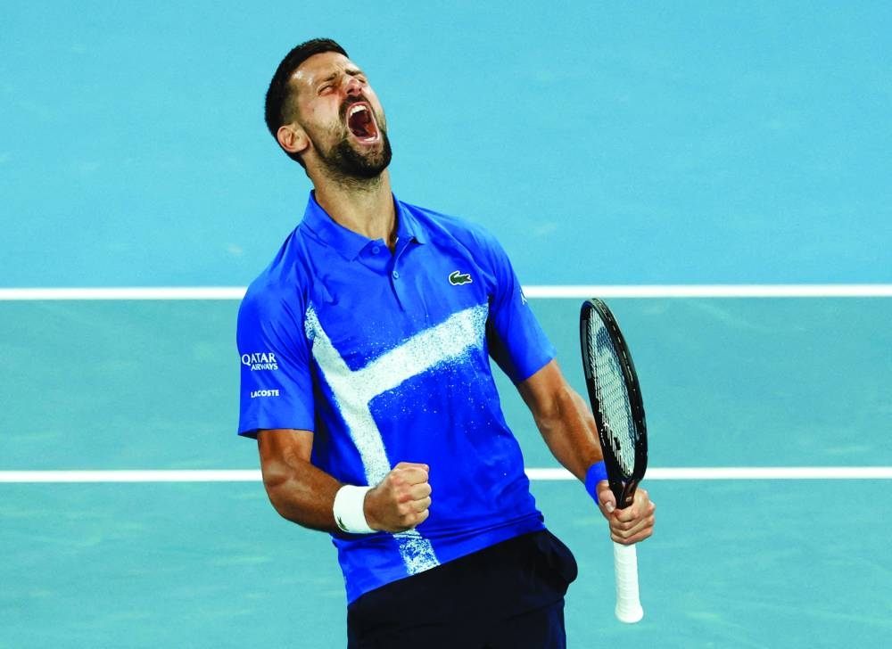 Serbia’s Novak Djokovic celebrates winning his third-round match against Czech Republic’s Tomas Machac at the Australian Open on Friday. (Reuters)