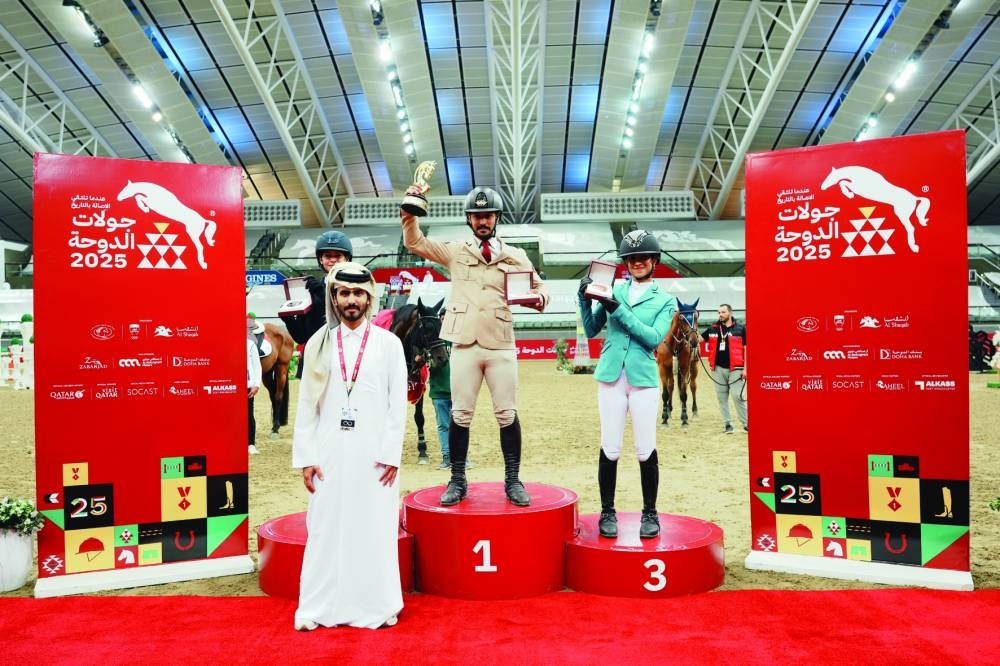 The podium winners of the CSI1* - Faults & Time - 1.20m class Hussain Ali al-Kaabi of Qatar, Naden Asaal of Egypt and Fonoon Alhumaidan of Saudi pose with Abdullah al-Qashouti, Marketing and Communications Manager of Doha International Tour.