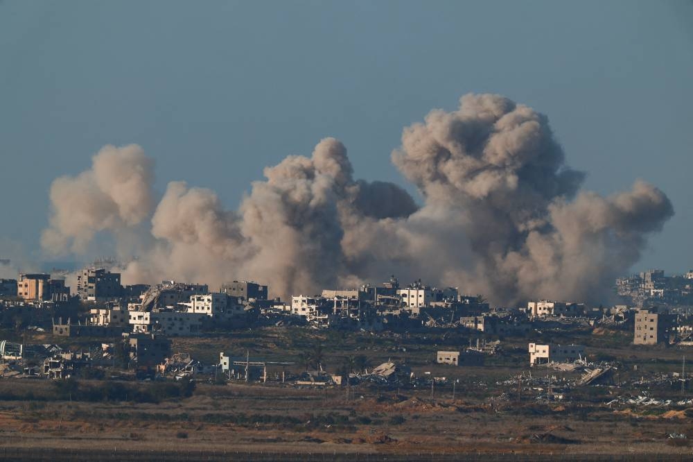 Smoke rises inside the Gaza Strip, before a ceasefire deal between Israel and Hamas goes into effect, as seen from southern Israel, on Saturday. REUTERS