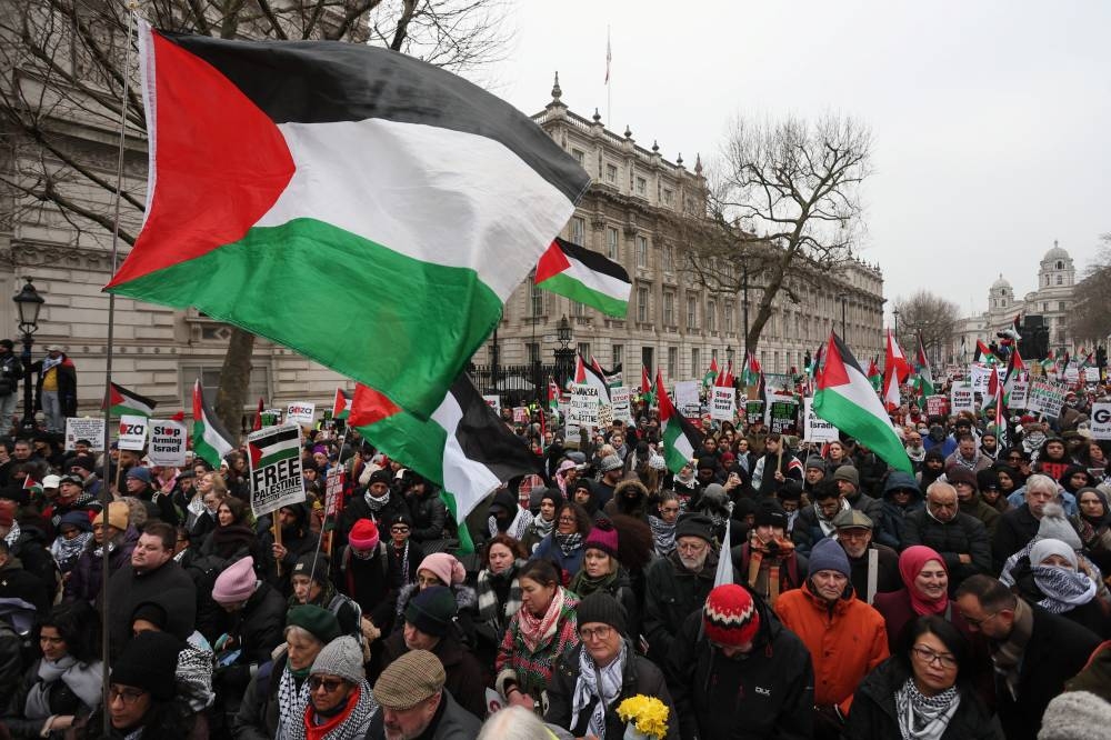 People attend a demonstration in support of Palestinians in Gaza, after Israel and Hamas reached a ceasefire deal, in London, Britain, on Saturday. REUTERS