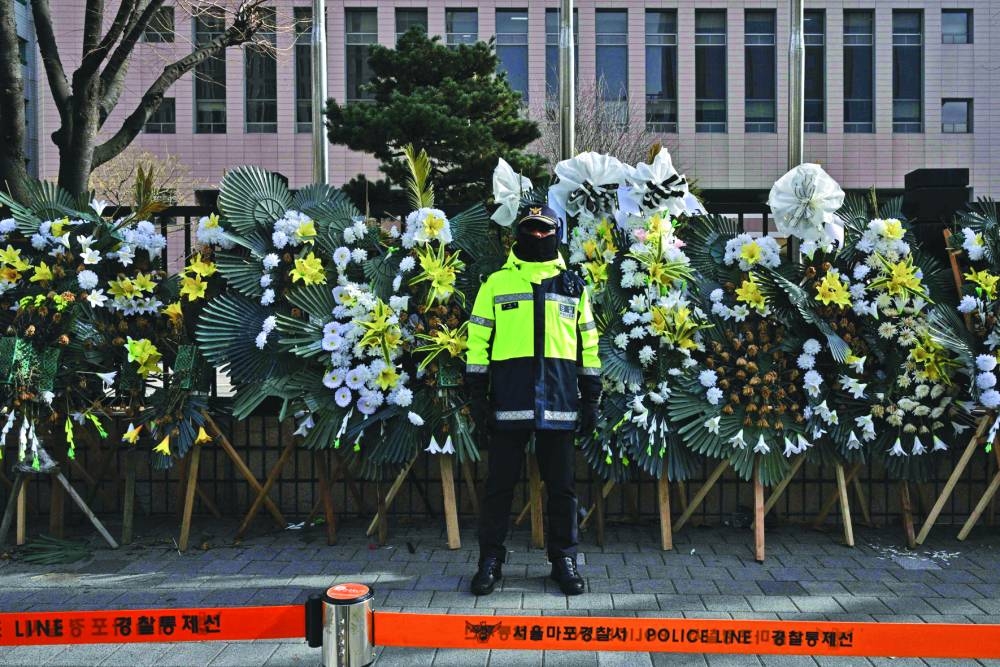 
A policeman stands guard outside the Seoul Western District Court in Seoul. 