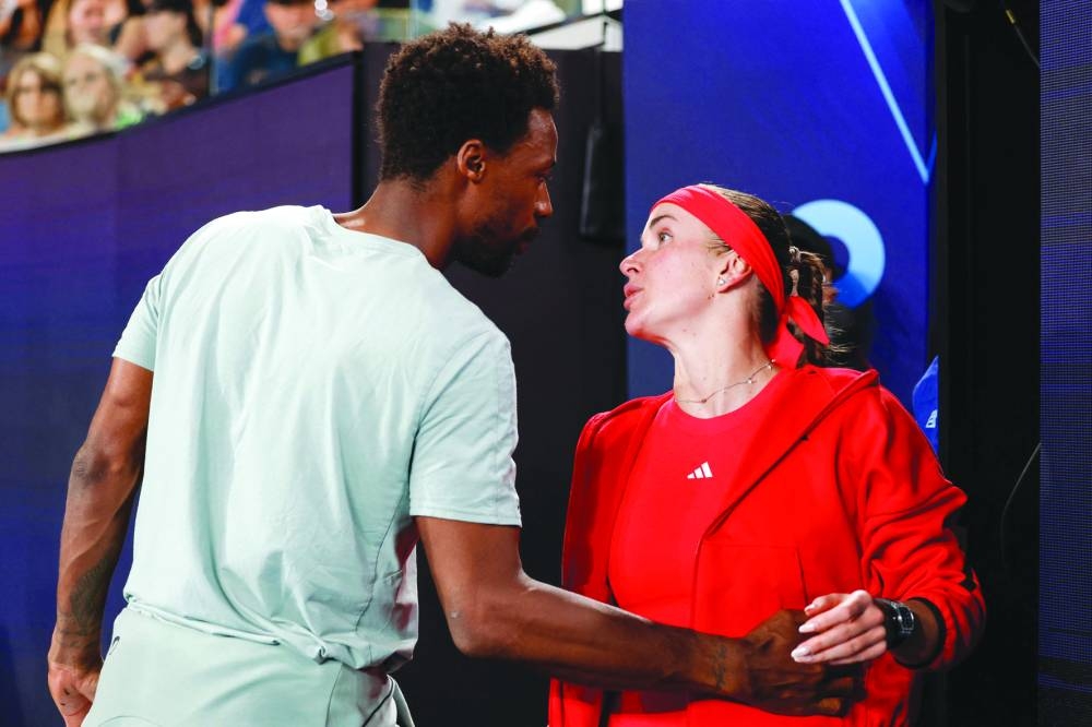 France’s Gael Monfils (left) with his wife Ukraine’s Elina Svitolina following her victory against Italy’s Jasmine Paolini in the Australian Open in Melbourne on Saturday. (AFP)
