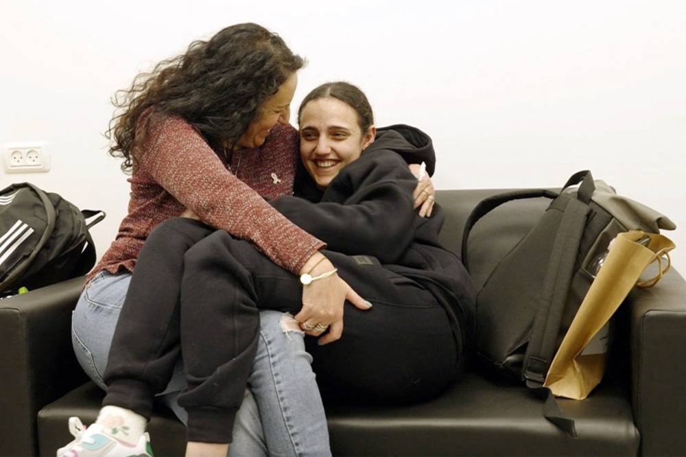 Former Israeli hostage Romi Gonen with her mother Merav at an undisclosed location in Israel on Sunday after a ceasefire and hostage-prisoner exchange deal in the war between Israel and Hamas was implemented. AFP PHOTO / Handout / Israeli Army