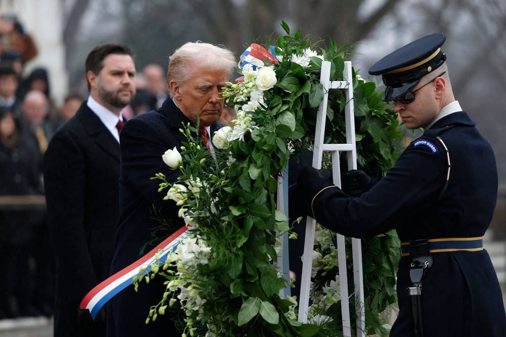 President-elect Donald Trump participates in a wreath-laying ceremony at Arlington National Cemetery Sunday