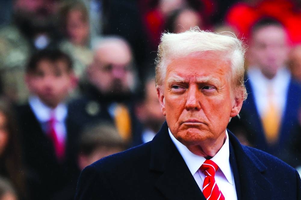 US President-elect Donald Trump attends a wreath laying ceremony at Arlington National Cemetery ahead of the presidential inauguration, in Arlington, Virginia, yesterday.