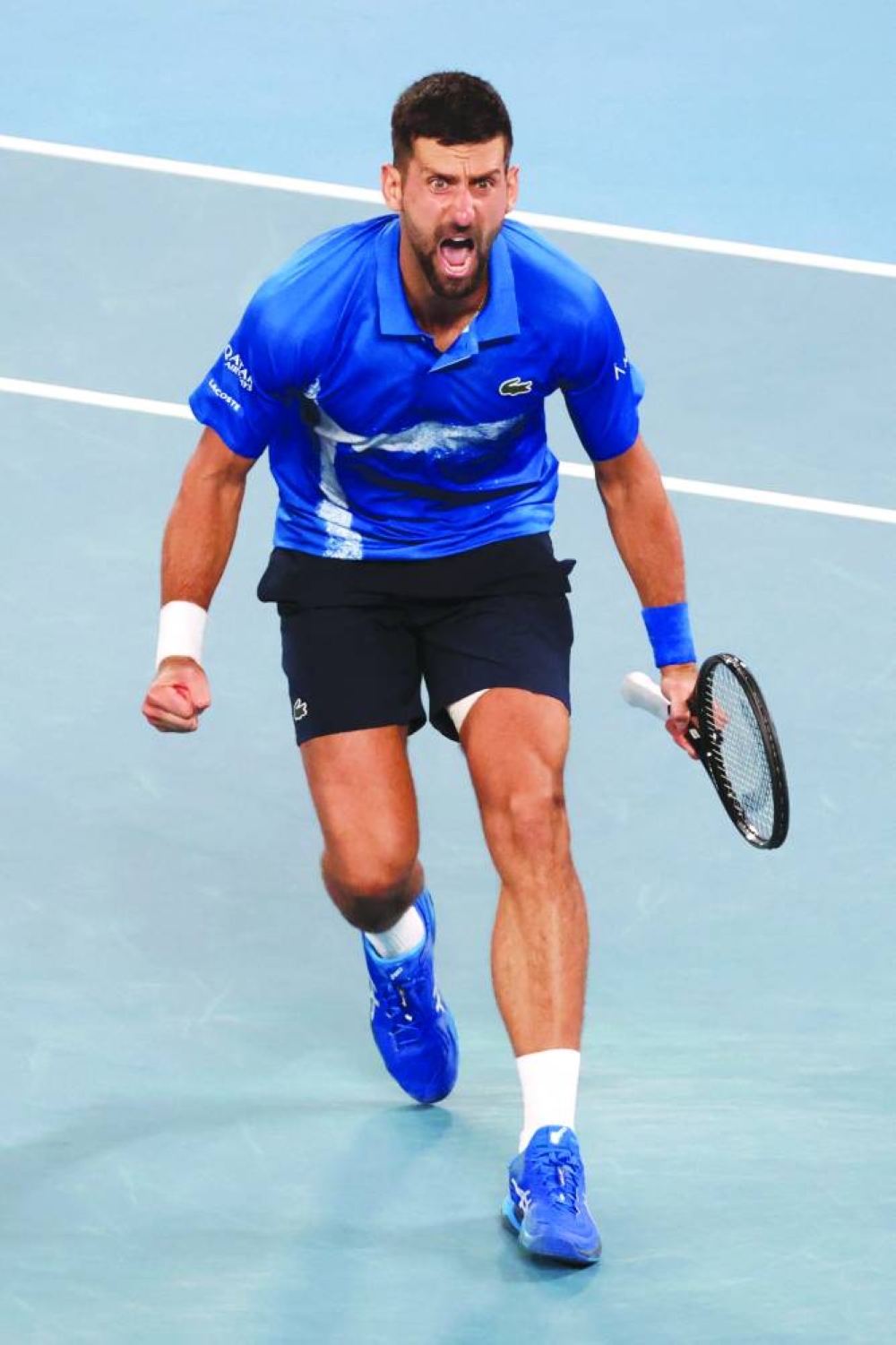 Serbia’s Novak Djokovic celebrates after his victory against Spain’s Carlos Alcaraz in their Australian Open quarter-final on Tuesday. (AFP)