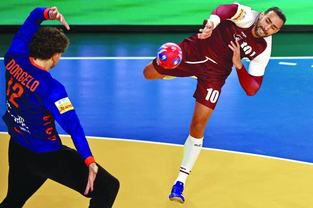 
Qatar’s Frankis Marzo attempts score past the Netherlands’ goalkeeper Matthias Dorgelo. 
