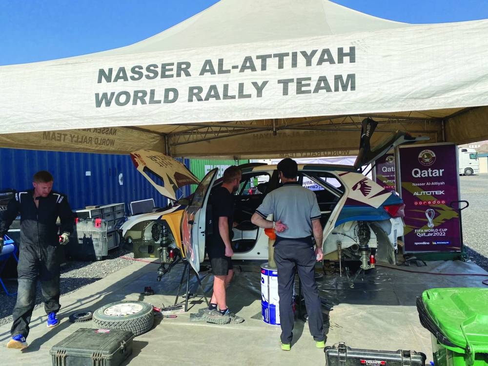 Autotek technicians work to prepare Nasser Saleh al-Attiyah’s car on Wednesday, on the eve of the Oman International Rally.