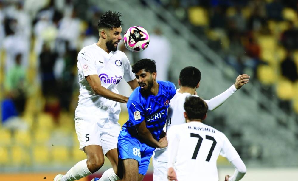 
Al Shahania and Al Khor players battle for the ball at the Suhaim Bin Hamad Stadium. 