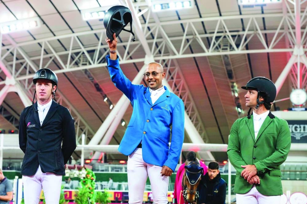 
Qatar’s Bassem Mohammed (centre) celebrates after winning the CSI5* - Faults & Time - 1.50m class during the Doha International Equestrian Tour at Al Shaqab. Britain’s Scott Brash (left) came second, while Portugal’s Duarte Seabra settled for the third place.
 