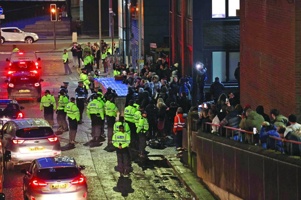 
Police contain protesters as news spreads that Rudakubana has left the court from a back entrance, outside The Queen Elizabeth II Law Courts in Liverpool, northwest England, after the sentencing of the Southport attacker. – AFP 