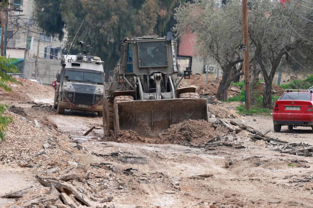 Israeli military vehicles deploy during a large-scale Israeli army raid in Jenin, in the occupied West Bank on Friday. AFP